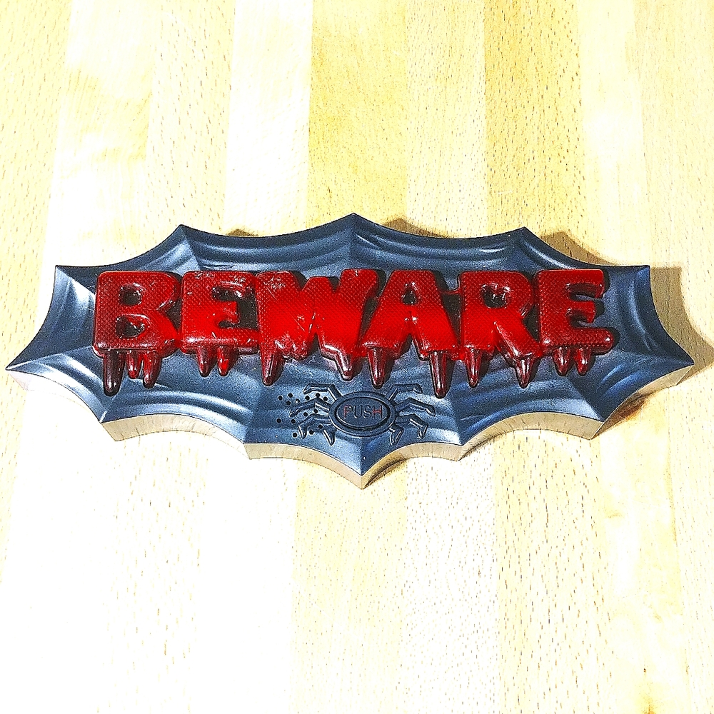 Halloween BEWARE Web Sign. Lights up and plays Ominous Music and Warning. Spooky